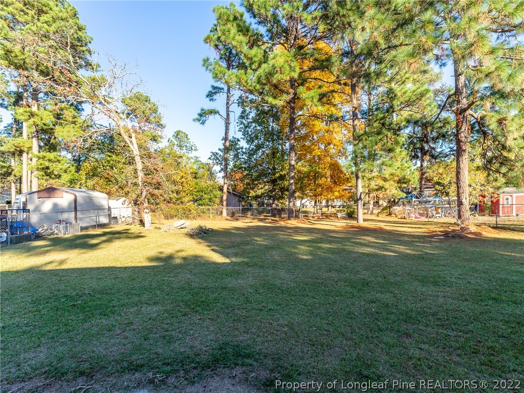 921 Hollydale Lane Fayetteville, NC 28314 - Photo 32 of 32 a view of yard with swimming pool and green space