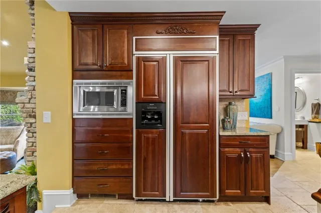 a living room with a couch and a potted plant