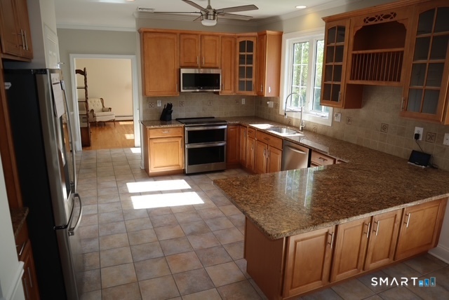 51 Brookfield Road Seymour, CT 06483 - Photo 11 of 37 a kitchen with stainless steel appliances granite countertop a refrigerator a stove and a sink