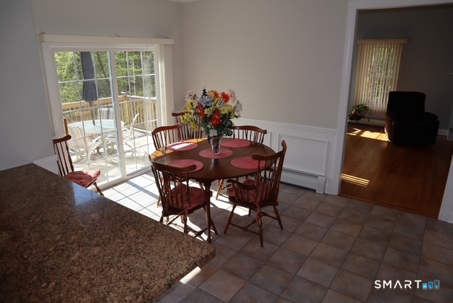 51 Brookfield Road Seymour, CT 06483 - Photo 12 of 37 a view of a dining room with furniture and a potted plant