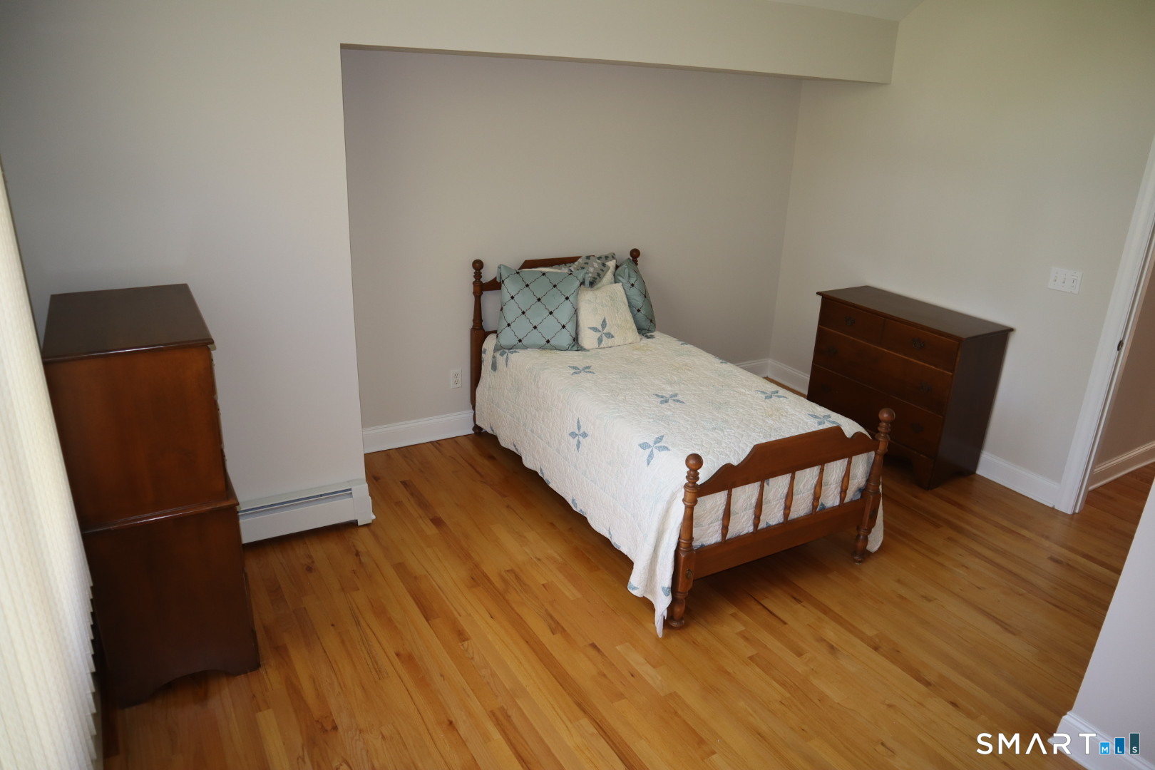 51 Brookfield Road Seymour, CT 06483 - Photo 25 of 37 a bedroom with a bed and wooden floor
