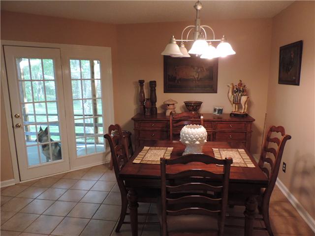 3480 Trough Springs Road Adams, TN 37010 - Photo 12 of 17 Plenty of room for a larger dining set; french doors lead to screened back porch.