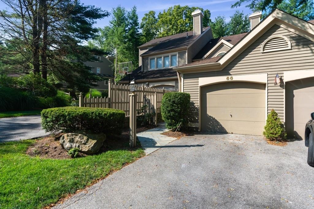 66 Boulder Ridge Road Scarsdale, NY 10583 - Photo 1 of 1 a view of a house with a yard and plants
