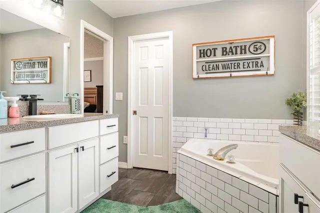 a bathroom with a sink a bathtub and a shower