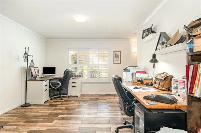 a room with furniture and a flat screen tv