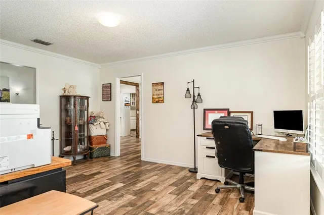 a workspace with furniture and wooden floor