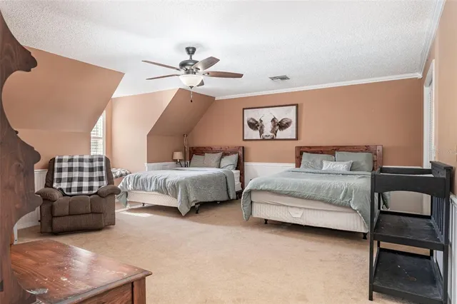 a bedroom with furniture and a ceiling fan