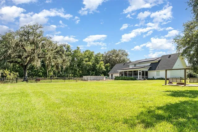 a view of a house with a big yard