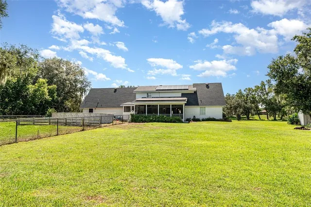 a view of a house with a big yard