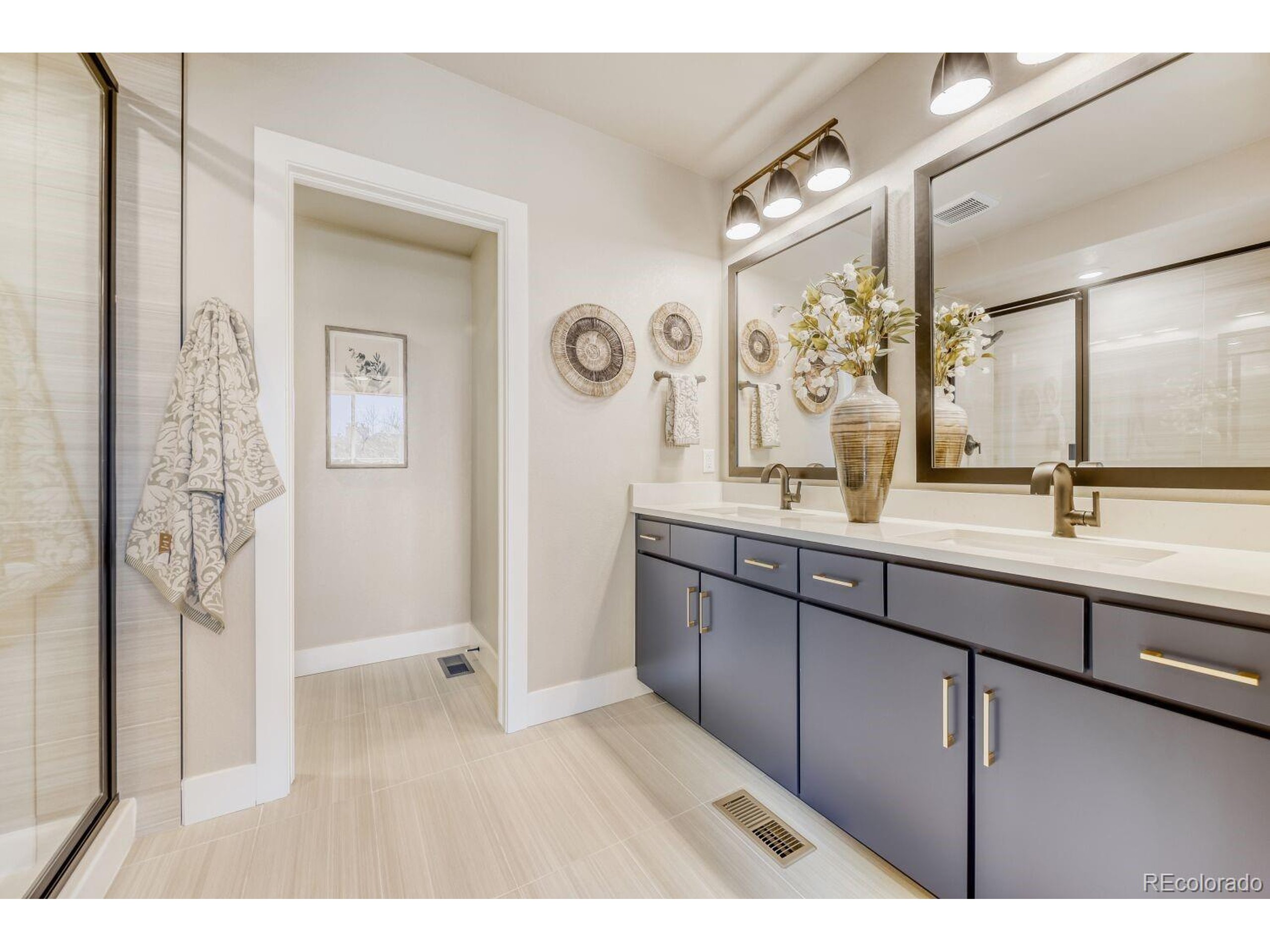 9195 Pierce Street, Unit 1 Westminster, CO 80021 - Photo 22 of 25 a bathroom with a sink and a mirror