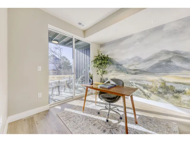 a living room with furniture and a gate