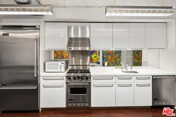 a kitchen with a stove and a refrigerator