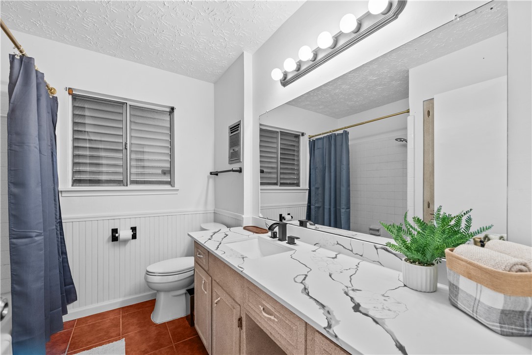 225 Pecos Drive Portland, TX 78374 - Photo 13 of 17 a bathroom with a granite countertop sink and a mirror