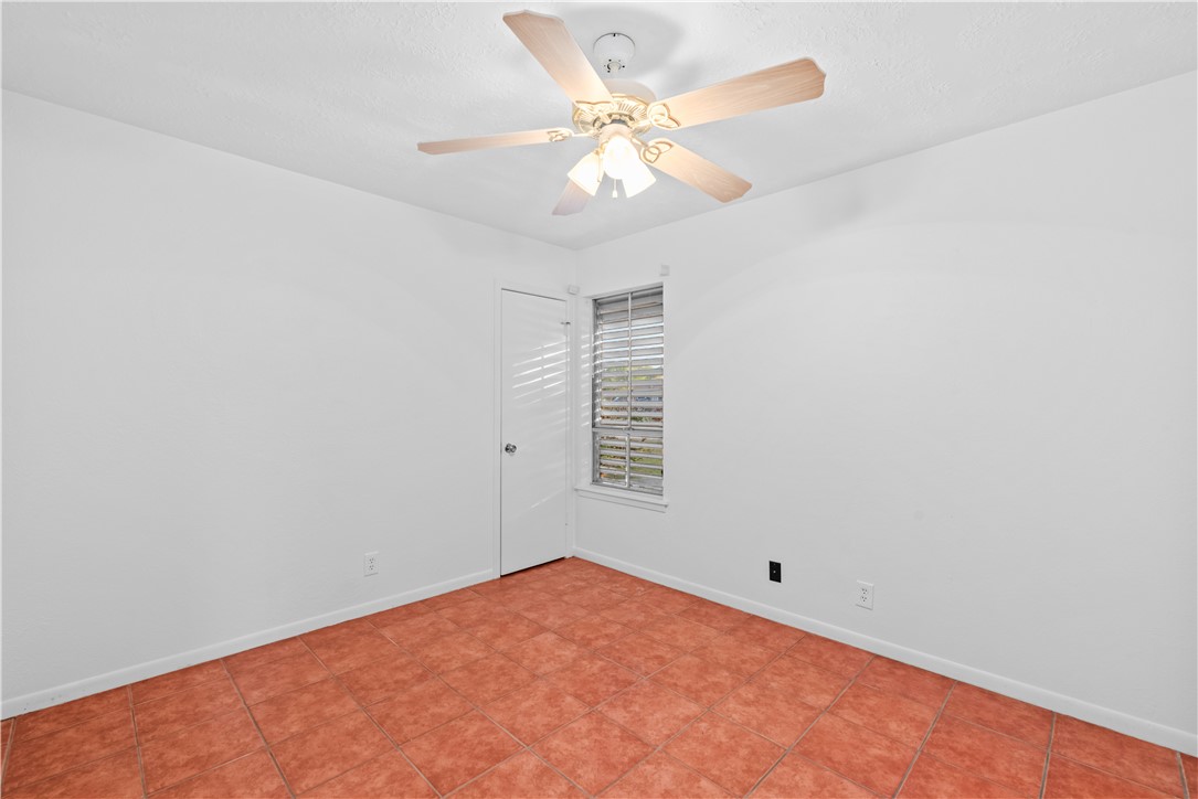 225 Pecos Drive Portland, TX 78374 - Photo 14 of 17 an empty room with windows and fan