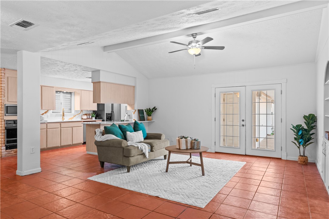 225 Pecos Drive Portland, TX 78374 - Photo 3 of 17 a living room with furniture and kitchen view