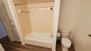 a bathroom with a tub and a shower