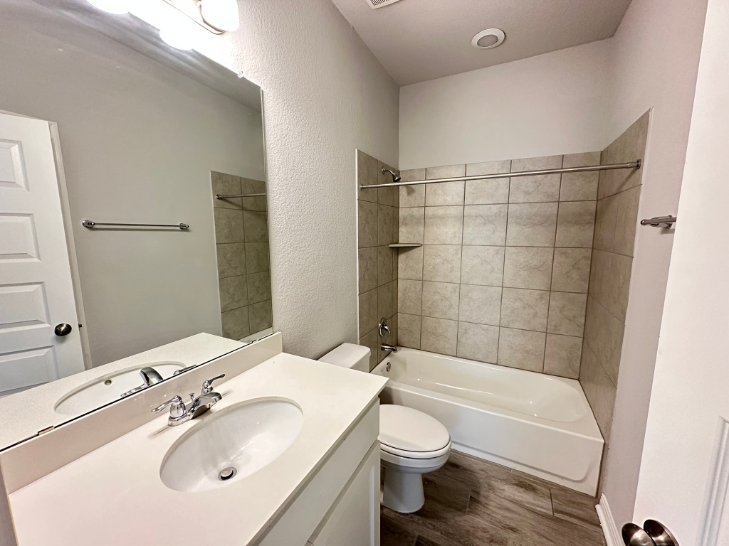 224 Wild Wind Trail Jarrell, TX 76537 - Photo 8 of 13 a bathroom with a sink toilet and shower