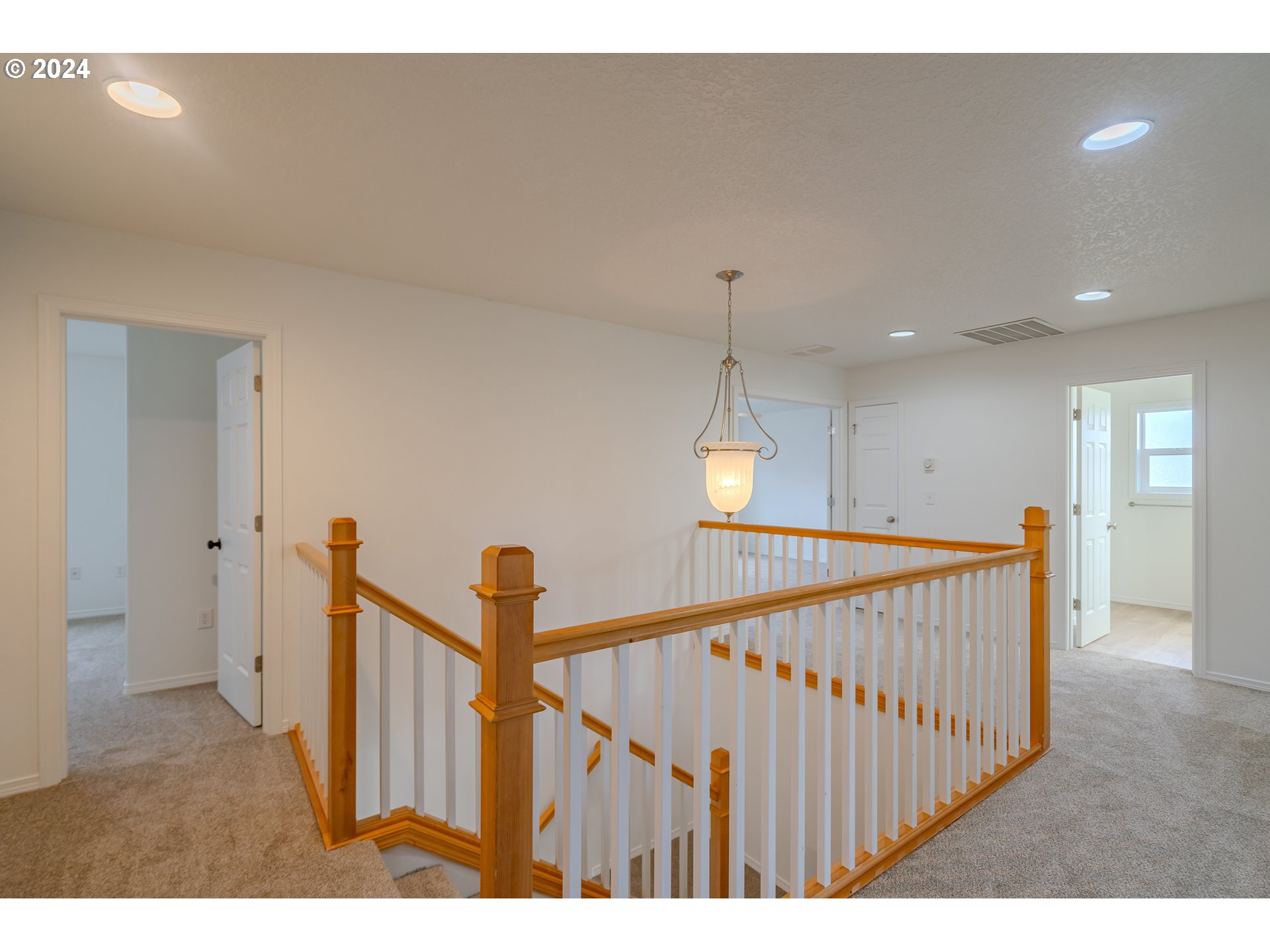 314 South 34th Place Ridgefield, WA 98642 - Photo 19 of 48 a view of staircase with railing and a rug