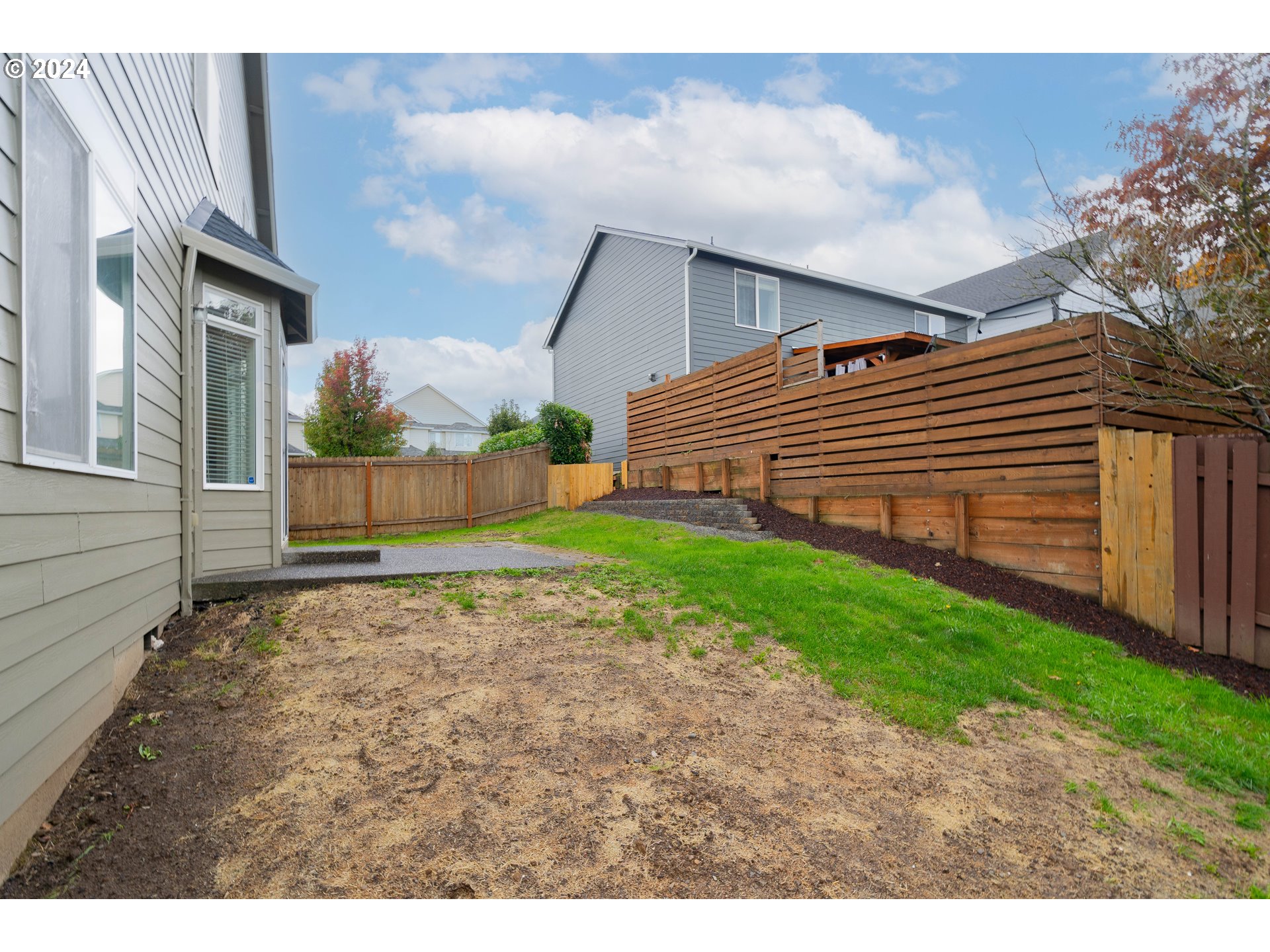 314 South 34th Place Ridgefield, WA 98642 - Photo 46 of 48 a backyard of a house with wooden fence