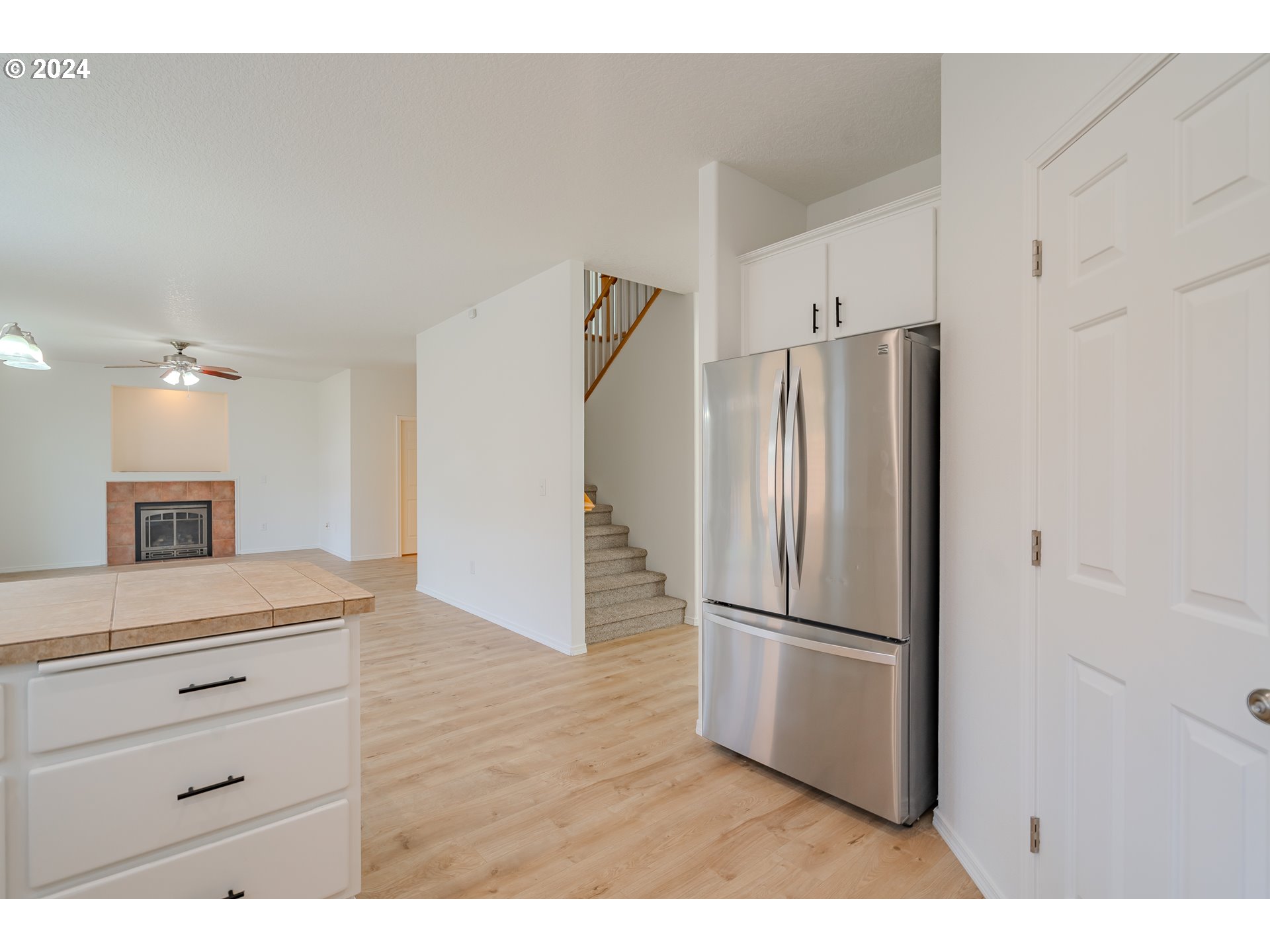 314 South 34th Place Ridgefield, WA 98642 - Photo 9 of 48 a kitchen with a refrigerator and a sink