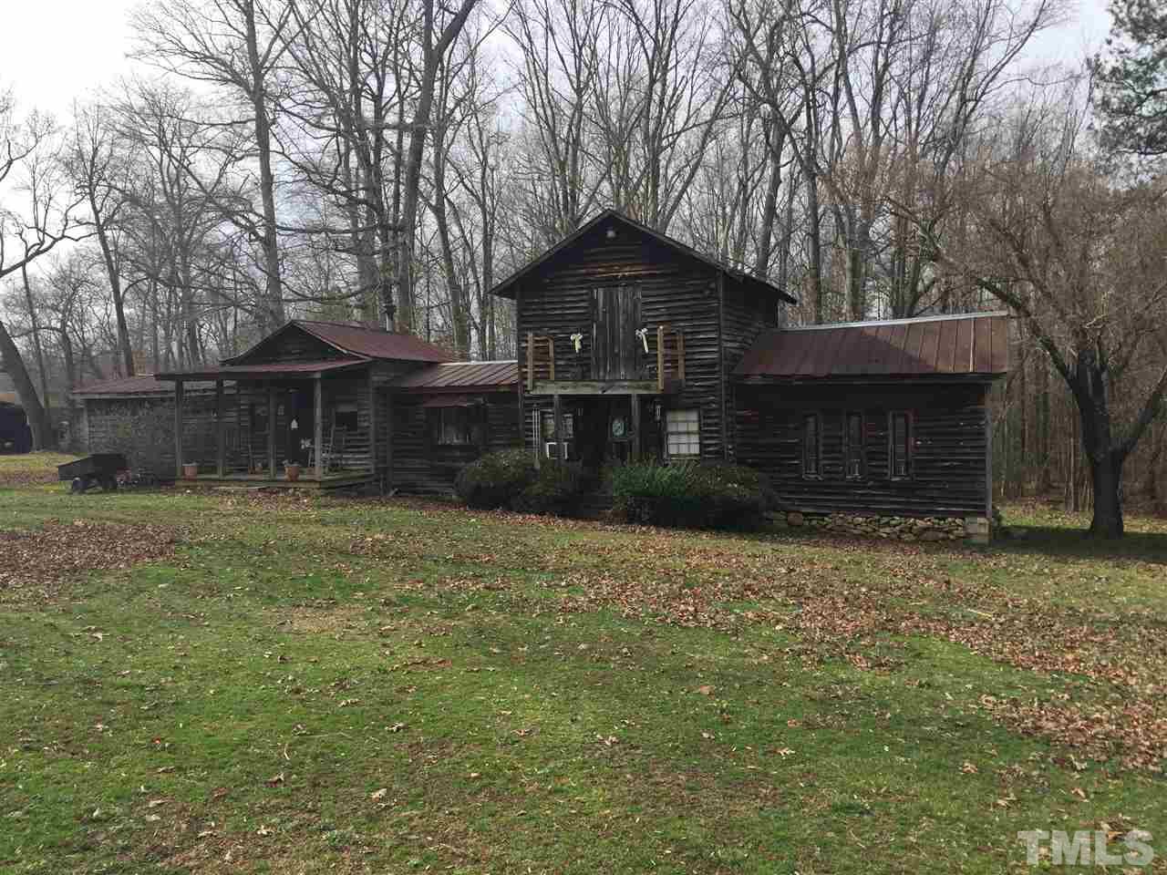 1806 Whitt Town Road Roxboro, NC 27574 - Photo 4 of 11 a front view of a house with a yard