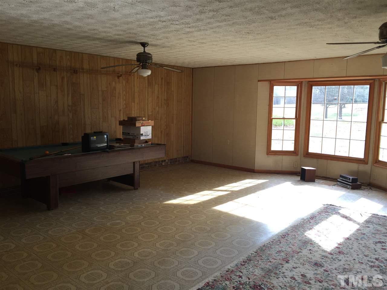 1806 Whitt Town Road Roxboro, NC 27574 - Photo 8 of 11 a bedroom with a bed and a window