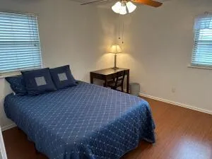 a bedroom with a bed and a lamp