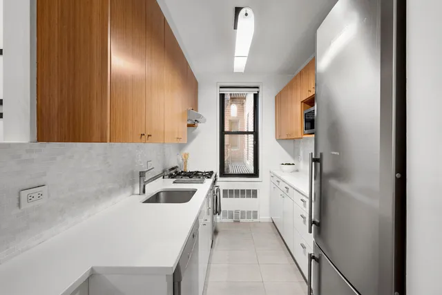 a bathroom with a sink a mirror and a bathtub
