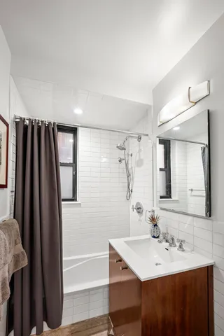 a view of a workspace with furniture and wooden floor