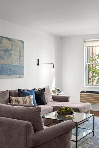 a bedroom with a bed and a table