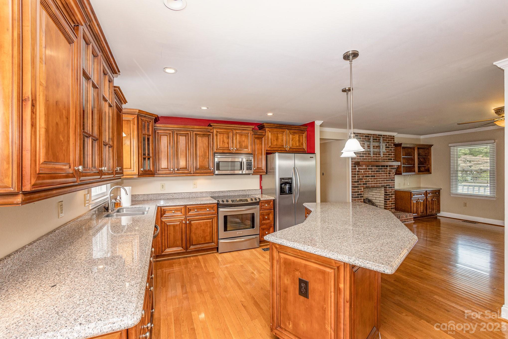 15531 Stumptown Road Huntersville, NC 28078 - Photo 12 of 35 a kitchen with stainless steel appliances granite countertop a sink and counter space