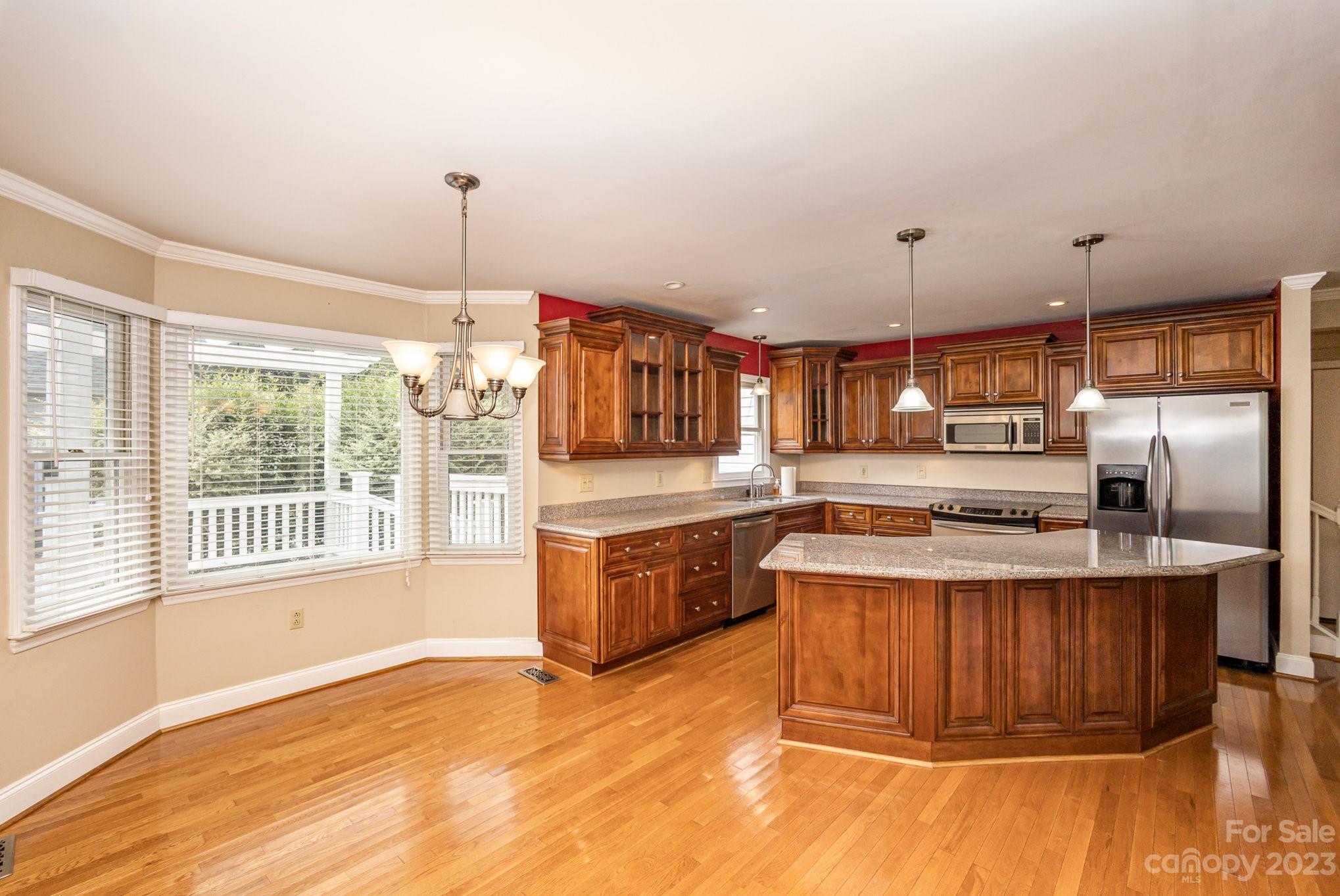 15531 Stumptown Road Huntersville, NC 28078 - Photo 15 of 35 a kitchen with stainless steel appliances granite countertop a stove and a sink