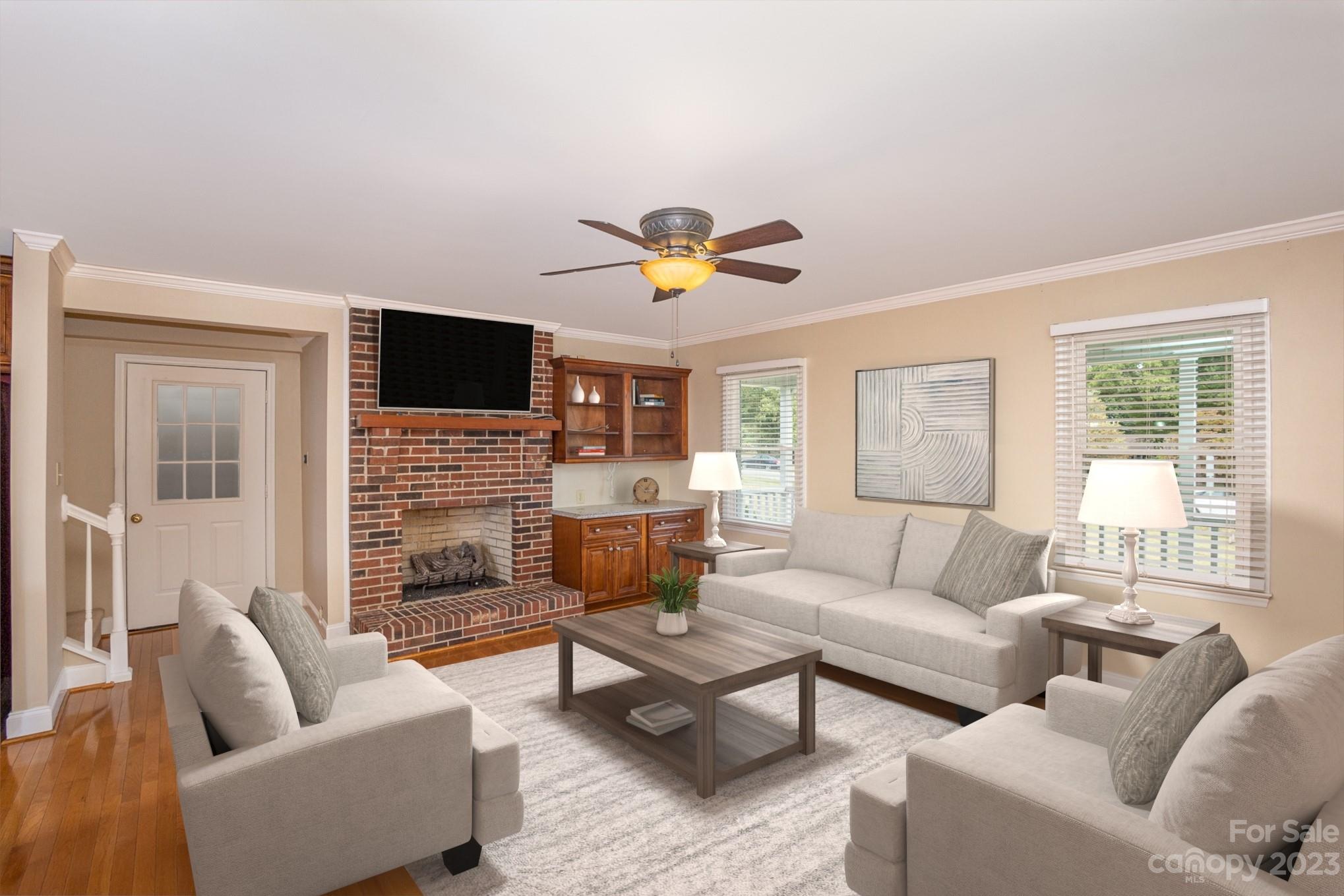 15531 Stumptown Road Huntersville, NC 28078 - Photo 16 of 35 a living room with furniture a fireplace and a flat screen tv