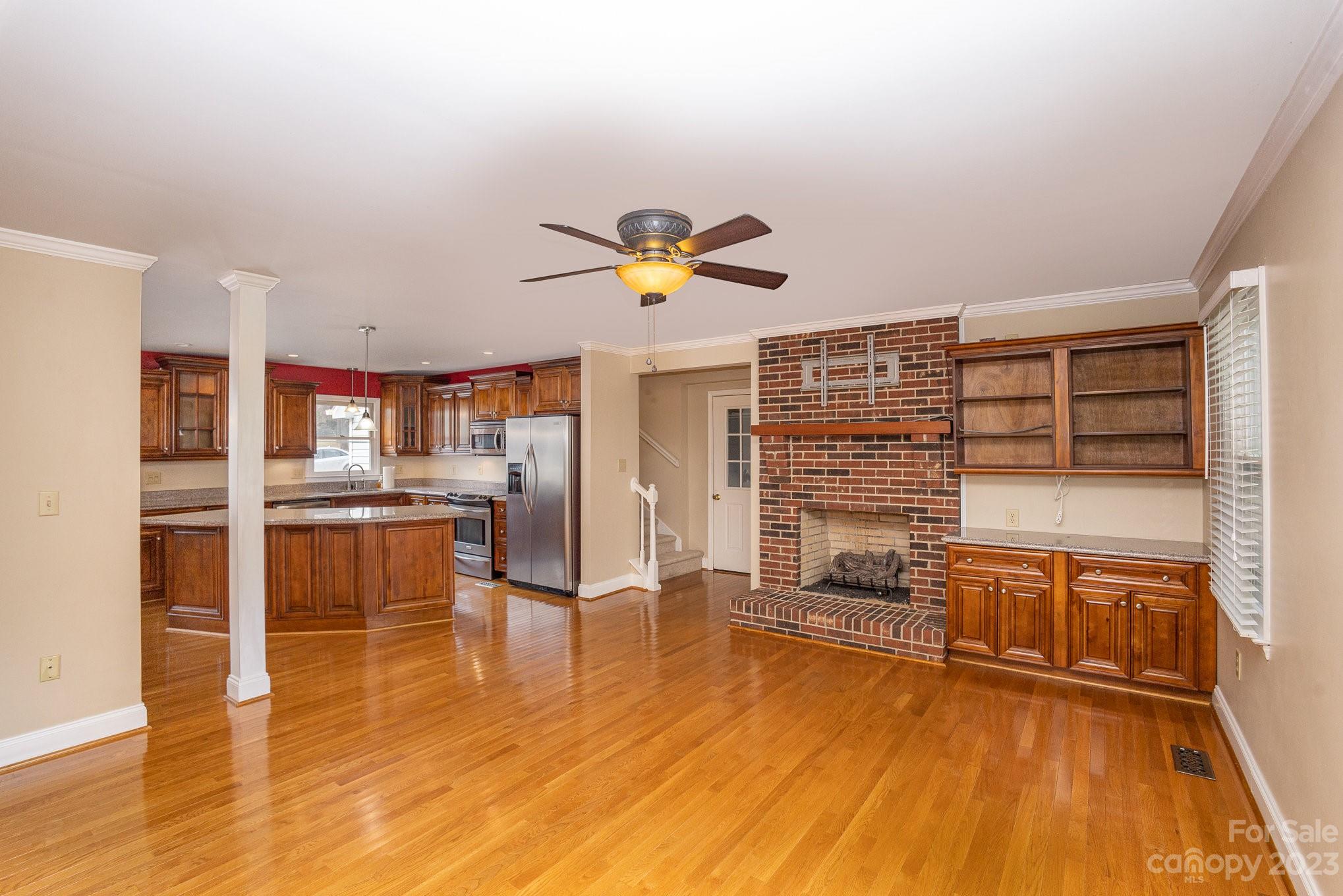 15531 Stumptown Road Huntersville, NC 28078 - Photo 17 of 35 a living room with stainless steel appliances furniture and a wooden floor