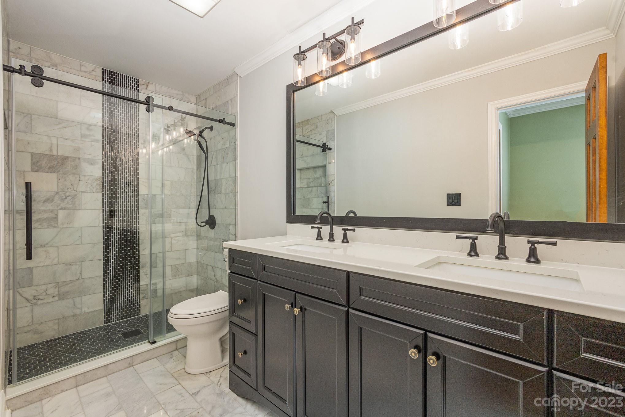 15531 Stumptown Road Huntersville, NC 28078 - Photo 20 of 35 a bathroom with a double vanity sink toilet mirror and shower