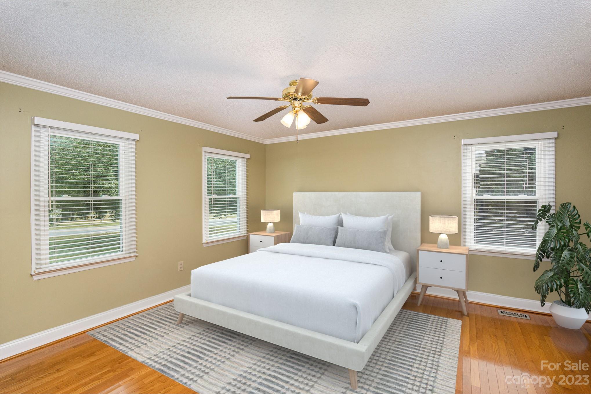 15531 Stumptown Road Huntersville, NC 28078 - Photo 22 of 35 a bedroom with a large bed chandelier and a window