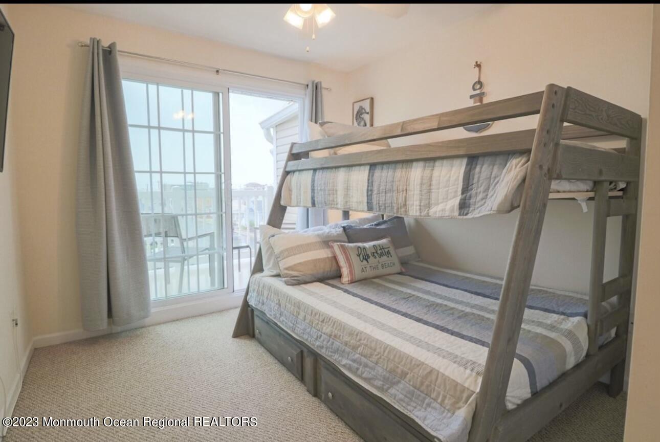 1301 Ocean Boulevard, Unit 10 Seaside Heights, NJ 08751 - Photo 11 of 13 a bedroom with furniture and a window