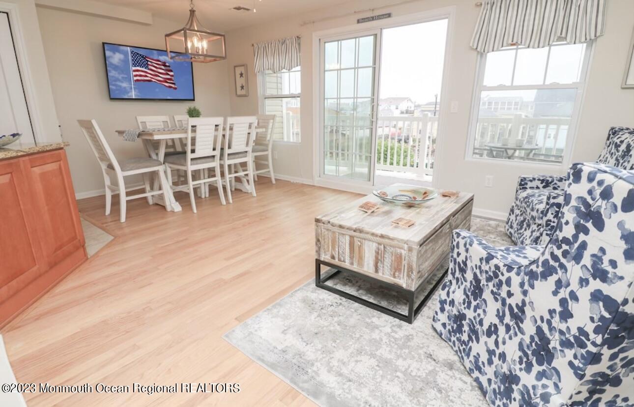 1301 Ocean Boulevard, Unit 10 Seaside Heights, NJ 08751 - Photo 5 of 13 a living room with furniture and a large window