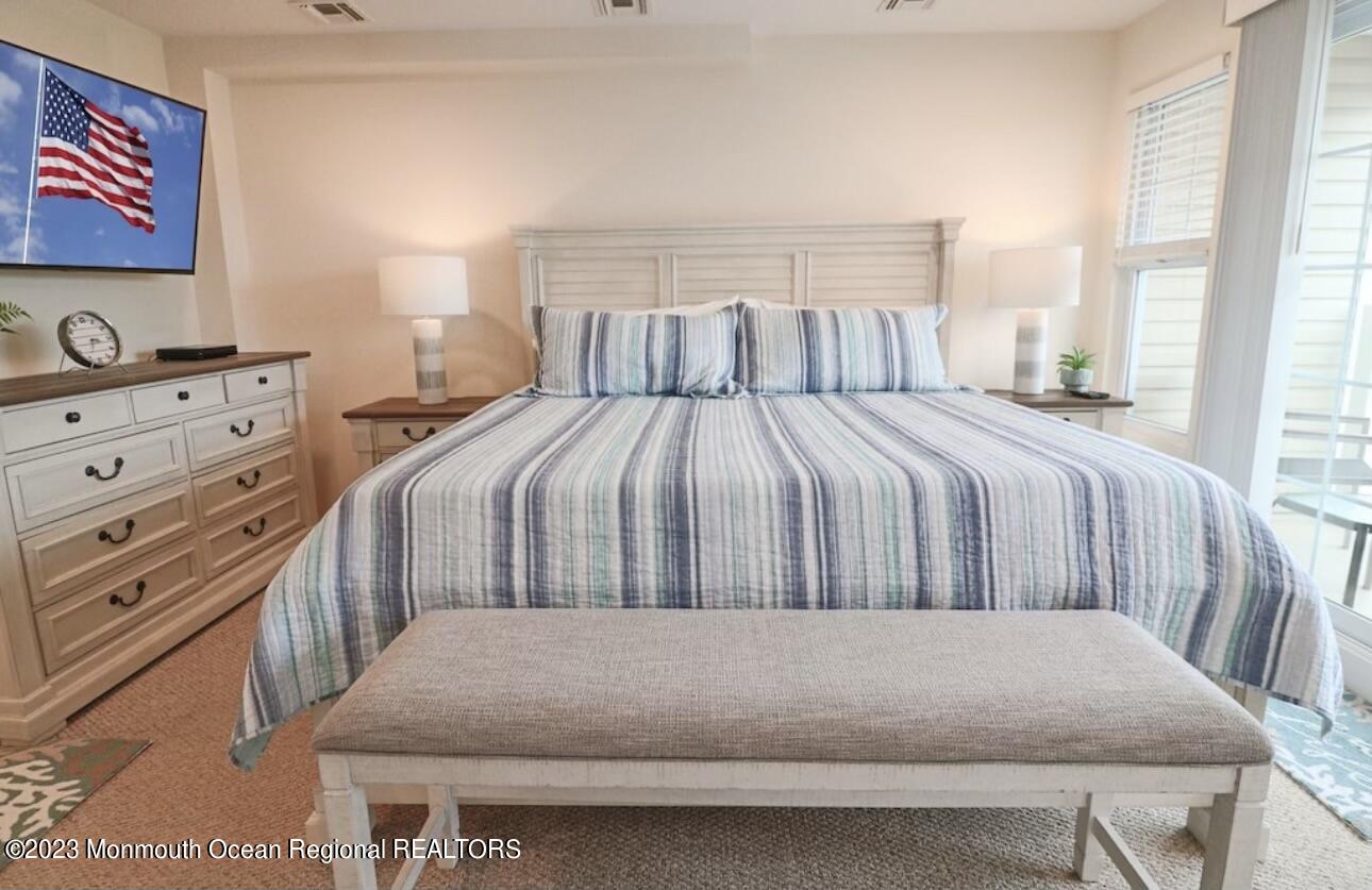 1301 Ocean Boulevard, Unit 10 Seaside Heights, NJ 08751 - Photo 8 of 13 a bedroom with a bed and window