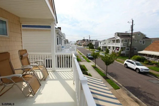 a view of a balcony with chairs