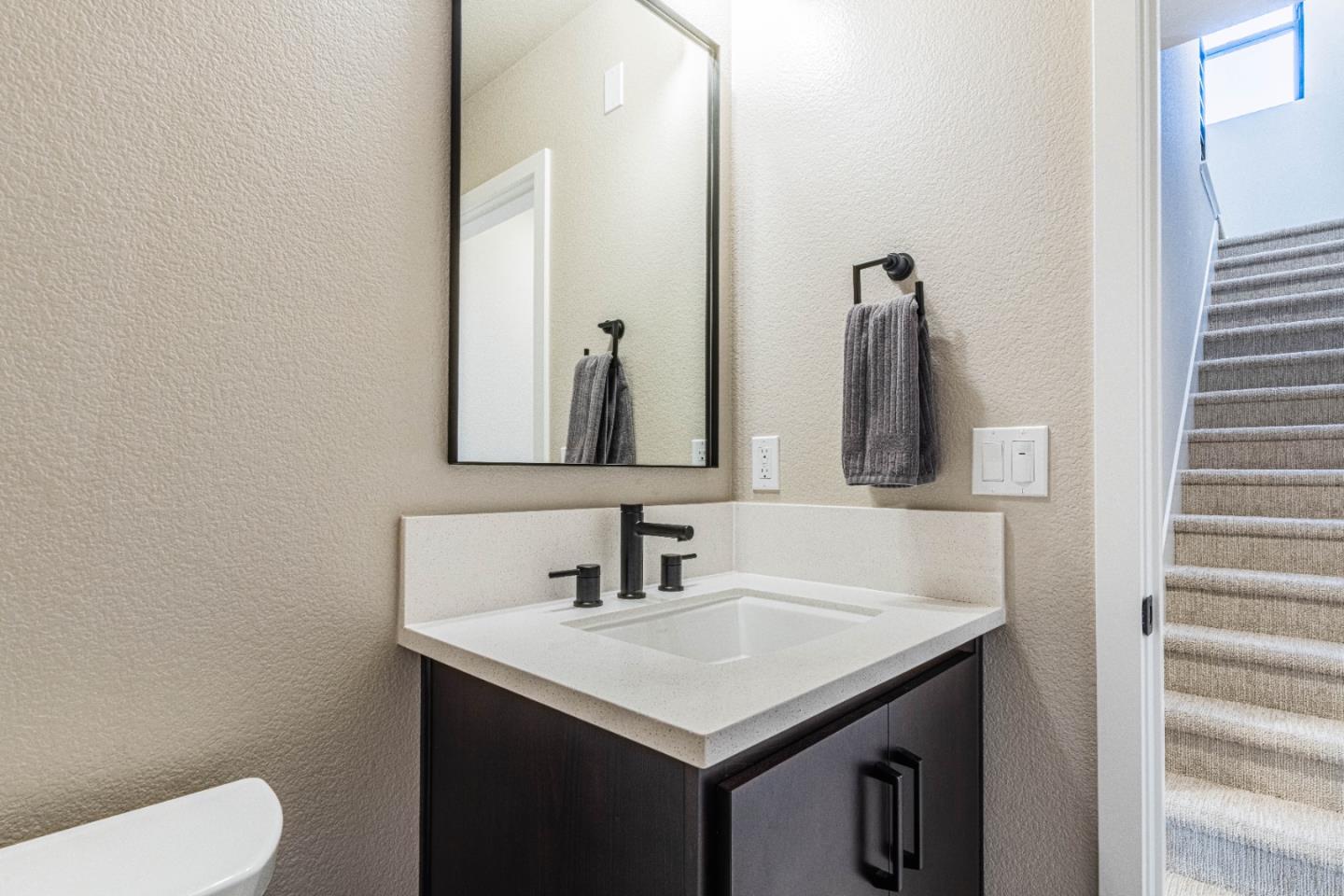 135 8th Street Marina, CA 93933 - Photo 38 of 69 a bathroom with a sink and a toilet