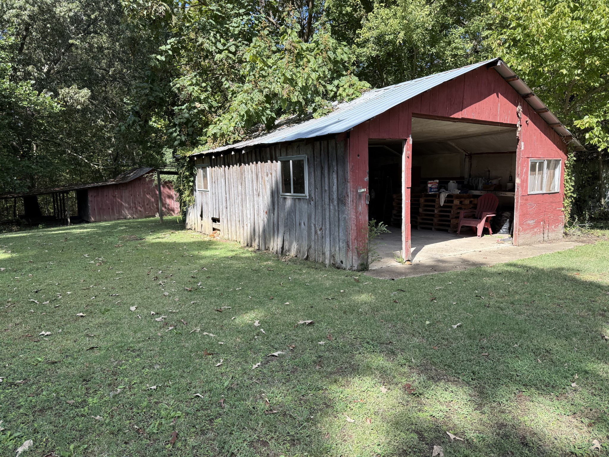 21625 Seminary Street Hollow Rock, TN 38342 - Photo 18 of 19 a view of a house with a yard