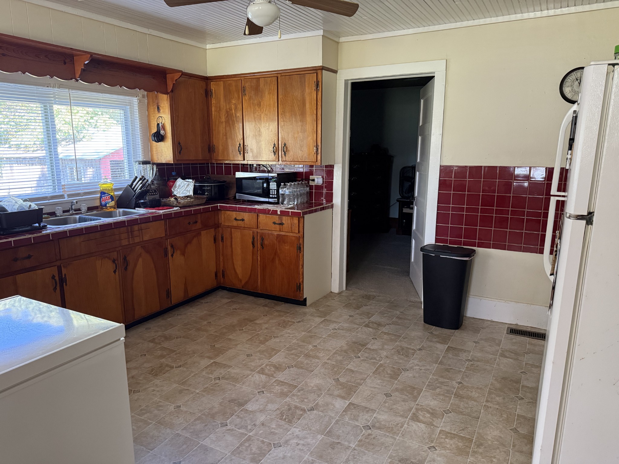 21625 Seminary Street Hollow Rock, TN 38342 - Photo 4 of 19 a kitchen with stainless steel appliances granite countertop a refrigerator and a sink