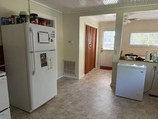 a utility room with closet dryer and washer