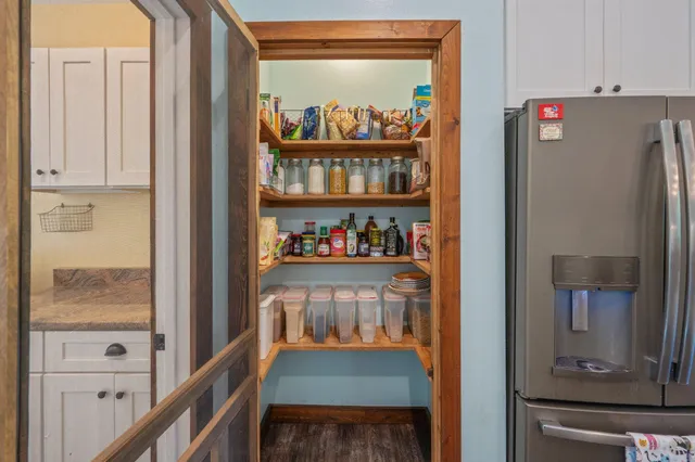 a view of an entryway with wooden floor