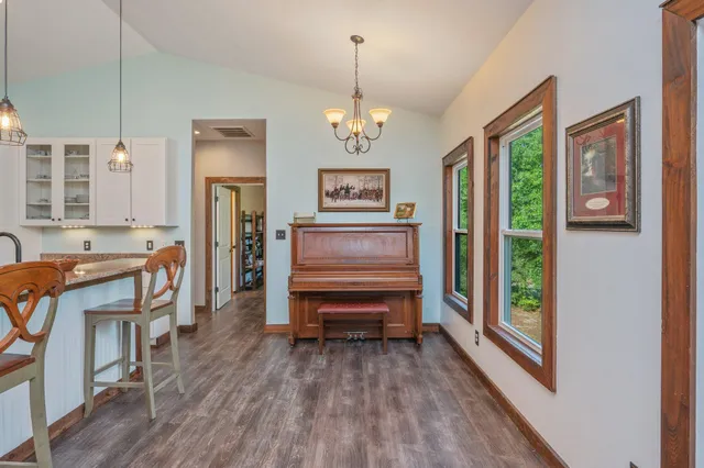 a view of a livingroom with furniture window and wooden floor