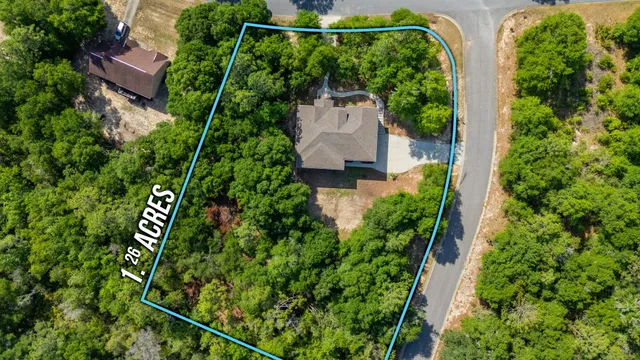 an aerial view of house with yard