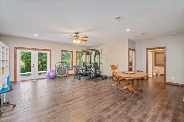 a view of a livingroom with furniture and a window