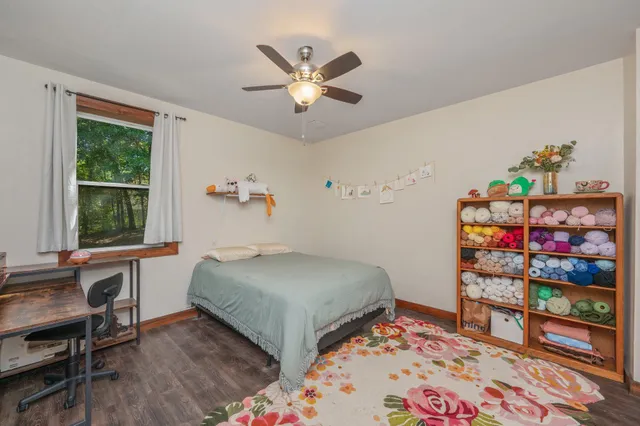 a bedroom with a bed and a table in it