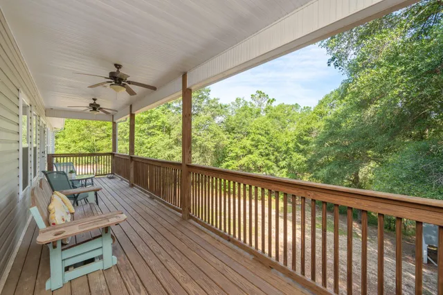 a view of a two chairs in the balcony
